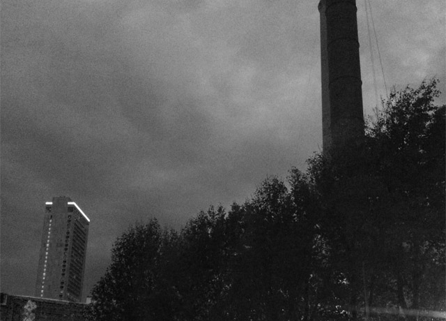 A distant building and some sort of stack